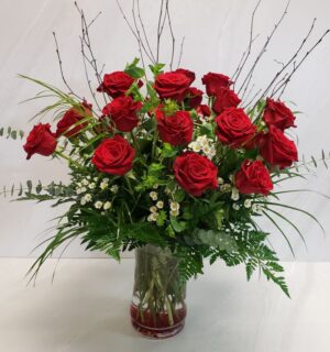 A large two dozen red rose floral arrangement
