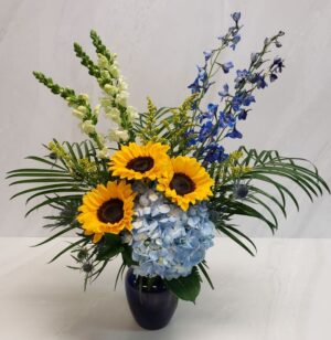 Blue, yellow and white floral arrangement symbolic to the Tampa Bay Rays Baseball team