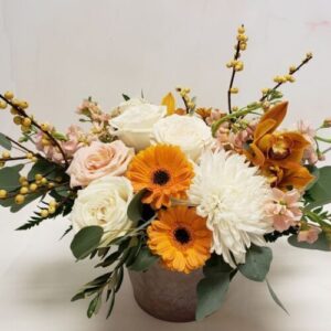 A lush combination of flowers arranged in a garden style for autumn.