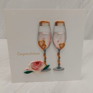 Quilling card of two champagne flutes with "Congratulations" written beside.
